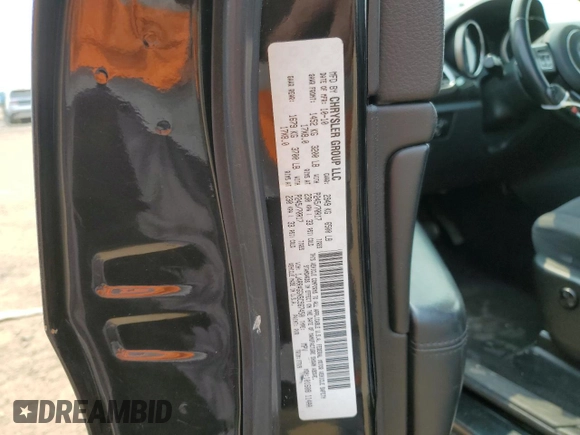 2011 Jeep Grand Cherokee Laredo with VIN 1J4RR4GGXBC567450, listed as a Copart auction lot 60056085 with 165,077 mi miles and Salvage title. Bid and sale history available at DreamBid. Image 12.