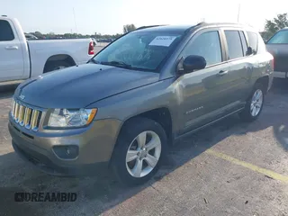 2011 Jeep Compass with VIN 1J4NT1FA4BD213994, listed as a IAAI auction lot 42020375 with 84,409 mi miles. Bid and sale history available at carsss.com. Image 2.