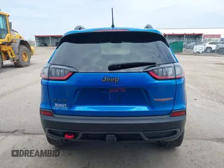2022 Jeep Cherokee Trailhawk z VIN 1C4PJMBX4ND513488, wystawiony jako IAAI lot #42137114 z przebiegiem 12 306 mil mil oraz . Historia ofert i sprzedaży dostępna na DreamBid. Obrazek 16.
