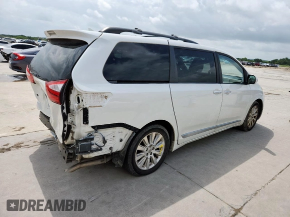 2015 Toyota Sienna XLE with VIN 5TDYK3DC4FS617099, listed as a Copart auction lot 61128025 with 114,508 mi miles and Salvage title. Bid and sale history available at DreamBid. Image 3.