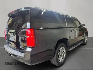 2015 Chevrolet Suburban LT with VIN 1GNSKJKC6FR60382, listed as a Copart auction lot 63533635 with 216,142 mi miles and Clean title. Bid and sale history available at DreamBid. Image 4.