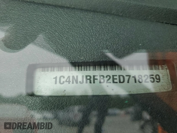2014 Jeep Patriot Latitude with VIN 1C4NJRFB2ED718259, listed as a Copart auction lot 58095825 with 116,665 mi miles and Salvage title. Bid and sale history available at DreamBid. Image 13.