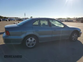 2000 Mitsubishi Galant LS with VIN 4A3AA56LXYE174881, listed as a Copart auction lot 79727154 with 106,001 mi miles and Salvage Title. Bid and sale history available at carsss.com. Image 3.