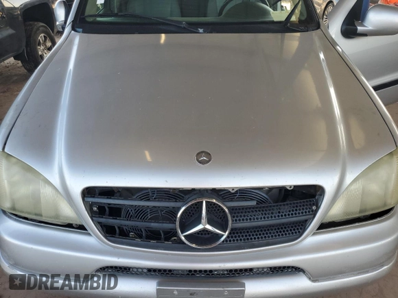 2000 Mercedes-Benz M-Class with VIN 4JGAB54E1YA193102, listed as a Copart auction lot 74294404 with 202,107 mi miles and Salvage Title. Bid and sale history available at carsss.com. Image 13.