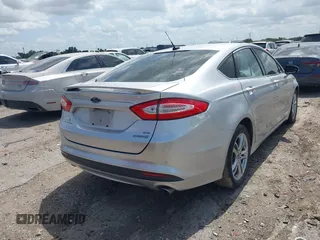 2016 Ford Fusion SE Hybrid z VIN 3FA6P0LU9GR203778, wystawiony jako IAAI lot #42438341 z przebiegiem 130 436 mil mil oraz . Historia ofert i sprzedaży dostępna na DreamBid. Obrazek 4.