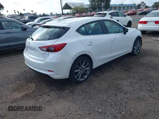 2018 Mazda 3 Touring with VIN 3MZBN1L31JM225108, listed as a IAAI auction lot 41959304 with 74,933 mi miles. Bid and sale history available at carsss.com. Image 4.