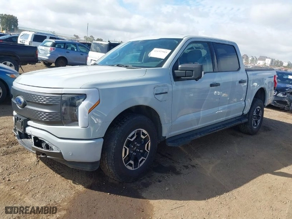 2023 Ford F-150 Lightning Pro with VIN 1FTVW1EL6PWG01336, listed as a IAAI auction lot 41692903 with 39,085 mi miles. Bid and sale history available at carsss.com. Image 2.