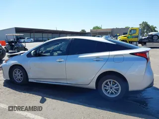 2021 Toyota Prius L Eco with VIN JTDKAMFUXM3144991, listed as a IAAI auction lot 42147025 with 106,466 mi miles and . Bid and sale history available at DreamBid. Image 13.