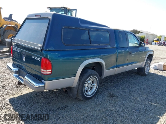 1999 Dodge Dakota SLT with VIN 1B7GG22Y2XS157214, listed as a IAAI auction lot 39776504 with 144,928 mi miles and . Bid and sale history available at carsss.com. Image 4.