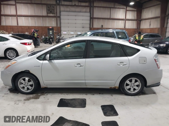 2007 Toyota Prius z VIN JTDKB20U977649489, wystawiony jako IAAI lot #41772600 z przebiegiem 248 525 mil mil oraz . Historia ofert i sprzedaży dostępna na DreamBid. Obrazek 14.