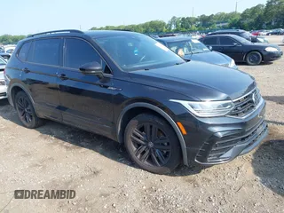 2022 Volkswagen Tiguan SE R-Line Black with VIN 3VV8B7AX6NM051090, listed as a IAAI auction lot 42522563 with 105,087 mi miles and . Bid and sale history available at DreamBid. Image 1.