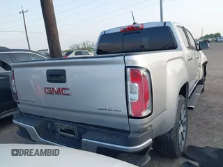 2018 GMC Canyon 2WD Denali z VIN 1GTG5EENXJ1256837, wystawiony jako IAAI lot #42139397 z przebiegiem 93 024 mil mil oraz . Historia ofert i sprzedaży dostępna na DreamBid. Obrazek 4.