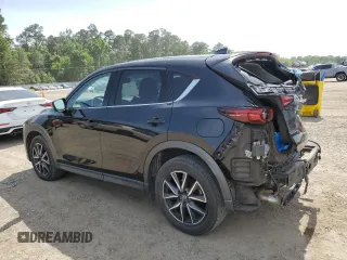 2018 Mazda CX-5 Grand Touring z VIN JM3KFADM2J1381752, wystawiony jako Copart lot #56889835 z przebiegiem 96 820 mil mil oraz Szkoda całkowita • Salvage title. Historia ofert i sprzedaży dostępna na DreamBid. Obrazek 2.