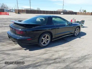 1997 Pontiac Firebird Trans Am with VIN 2G2FV22P7V2215905, listed as a IAAI auction lot 41764996 with 112,368 mi miles. Bid and sale history available at carsss.com. Image 4.