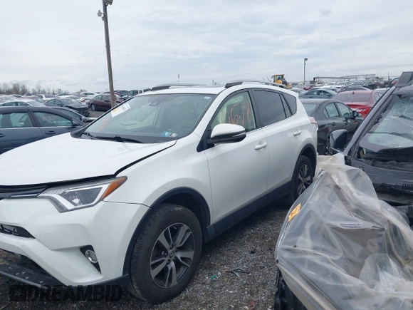 2018 Toyota RAV4 XLE with VIN JTMRFREV8JJ225065, listed as a IAAI auction lot 41940678 with 145,074 mi miles. Bid and sale history available at carsss.com. Image 14.