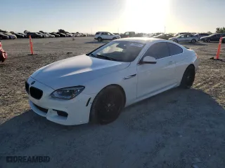 2012 BMW 6 Series 650i with VIN WBALX3C58CC528435, listed as a Copart auction lot 71568814 with 103,110 mi miles and Salvage Title. Bid and sale history available at carsss.com. Image 1.