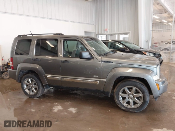 2012 Jeep Liberty Sport with VIN 1C4PJMAK9CW176792, listed as a IAAI auction lot 41685594 with 213,748 mi miles. Bid and sale history available at carsss.com. Image 12.