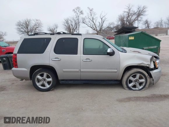 2007 Chevrolet Tahoe LTZ z VIN 1GNFK13037J332824, wystawiony jako IAAI lot #41505874 z przebiegiem 219 823 mil mil oraz . Historia ofert i sprzedaży dostępna na DreamBid. Obrazek 13.