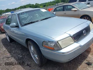 2003 Mercury Grand Marquis LS Premium z VIN 2MEFM75W63X623647, wystawiony jako IAAI lot #42236920 z przebiegiem 162 354 mil mil oraz . Historia ofert i sprzedaży dostępna na DreamBid. Obrazek 1.