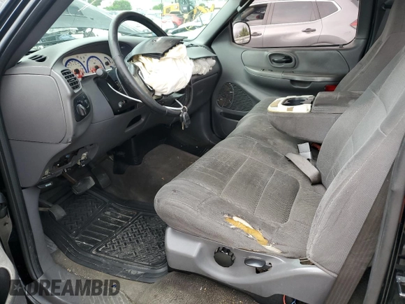 2003 Ford F-150 XL with VIN 1FTRF07W33KB56591, listed as a Copart auction lot 64170993 with 150,941 mi miles and Salvage title. Bid and sale history available at DreamBid. Image 7.