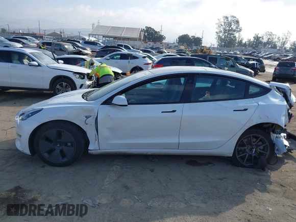 2022 Tesla Model 3 with VIN 5YJ3E1EA1NF167711, listed as a IAAI auction lot 41594266 with 50,554 mi miles and . Bid and sale history available at DreamBid. Image 14.