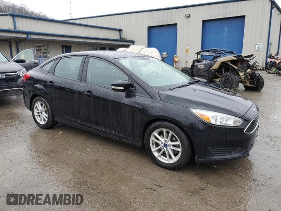 2017 Ford Focus SE with VIN 1FADP3F2XHL316724, listed as a Copart auction lot 52321155 with 137,005 mi miles and Salvage Title. Bid and sale history available at DreamBid. Image 4.