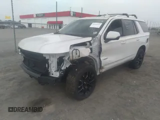 2022 Chevrolet Tahoe LT with VIN 1GNSKNKD5NR143276, listed as a IAAI auction lot 42268541 with 54,463 mi miles and . Bid and sale history available at DreamBid. Image 2.