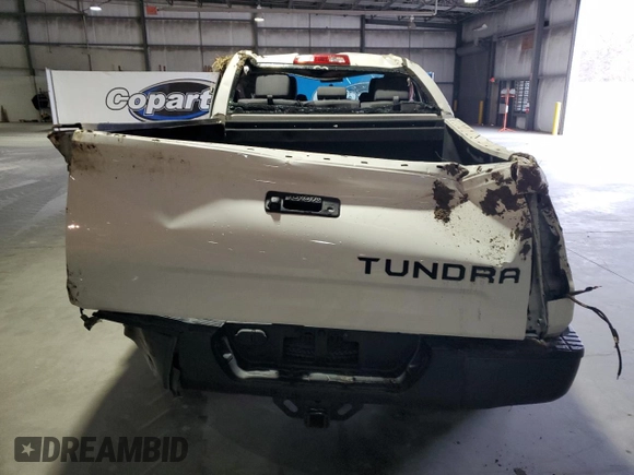 2016 Toyota Tundra SR z VIN 5TFRM5F11GX100988, wystawiony jako Copart lot #86719774 z przebiegiem Nie podano mil oraz Szkoda całkowita • Salvage title. Historia ofert i sprzedaży dostępna na DreamBid. Obrazek 6.