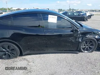 2024 Tesla Model Y z VIN 7SAYGDED6RF191135, wystawiony jako IAAI lot #41790922 z przebiegiem 17 154 mil mil oraz . Historia ofert i sprzedaży dostępna na DreamBid. Obrazek 13.