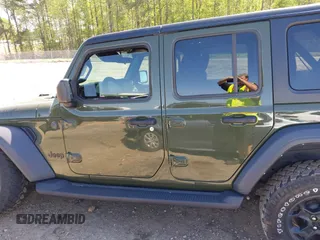 2023 Jeep Wrangler Sport S with VIN 1C4HJXDN0PW695795, listed as a IAAI auction lot 41974691 with 32,734 mi miles and . Bid and sale history available at DreamBid. Image 14.