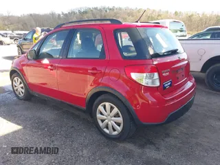 2010 Suzuki SX4 with VIN JS2YB5A34A6301801, listed as a IAAI auction lot 41884838 with 124,381 mi miles. Bid and sale history available at carsss.com. Image 3.