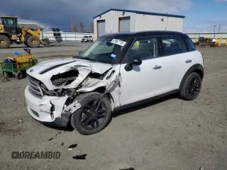 2015 MINI Countryman with VIN WMWZB3C50FWR44801, listed as a Copart auction lot 51957715 with 69,537 mi miles and Salvage Title. Bid and sale history available at DreamBid. Image 1.