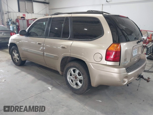 2004 GMC Envoy SLE with VIN 1GKDT13S442136464, listed as a IAAI auction lot 41874304 with 250,330 mi miles. Bid and sale history available at carsss.com. Image 3.