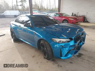 2018 BMW M2 with VIN WBS1J5C59JVA12718, listed as a IAAI auction lot 41796602 with 53,707 mi miles. Bid and sale history available at carsss.com. Image 1.