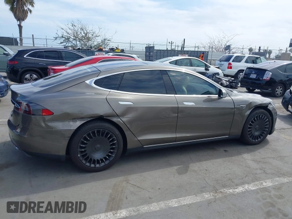 2015 Tesla Model S 85 with VIN 5YJSA1E14FF120455, listed as a IAAI auction lot 42053306 with 62,817 mi miles and . Bid and sale history available at DreamBid. Image 13.