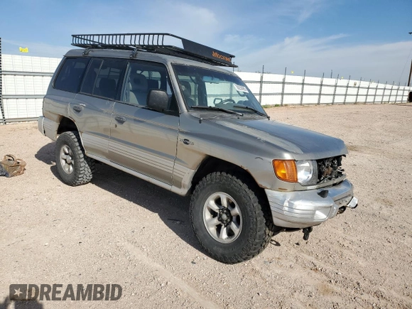 1998 Mitsubishi Montero z VIN JA4MR51R0WJ000921, wystawiony jako Copart lot #56250965 z przebiegiem 181 293 mil mil oraz Szkoda całkowita • Salvage title. Historia ofert i sprzedaży dostępna na DreamBid. Obrazek 4.