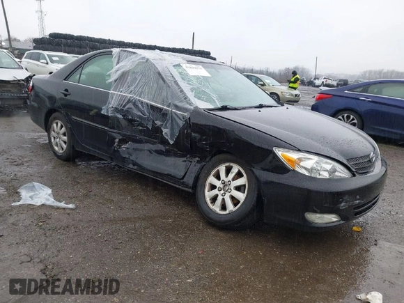 2003 Toyota Camry LE with VIN 4T1BE30K13U144114, listed as a IAAI auction lot 41829879 with 60,385 mi miles and . Bid and sale history available at DreamBid. Image 1.