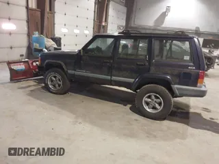 1999 Jeep Cherokee Sport with VIN 1J4FF68S2XL602709, listed as a IAAI auction lot 41177232 with 1 mi miles. Bid and sale history available at carsss.com. Image 3.