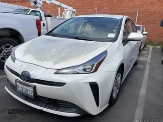 2019 Toyota Prius L Eco z VIN JTDKARFU9K3071624, wystawiony jako IAAI lot #42314452 z przebiegiem 126 176 mil mil oraz . Historia ofert i sprzedaży dostępna na DreamBid. Obrazek 1.