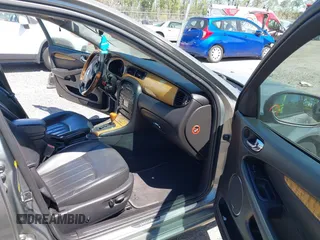 2004 Jaguar X-Type with VIN SAJEA51C04WD73023, listed as a IAAI auction lot 41874488 with 199,333 mi miles and . Bid and sale history available at DreamBid. Image 5.