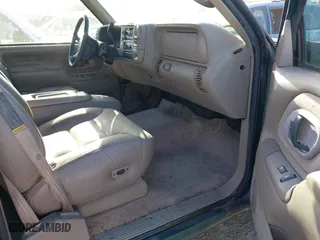 1997 Chevrolet Tahoe with VIN 1GNEK13RXVJ375189, listed as a IAAI auction lot 41959601 with 153,589 mi miles. Bid and sale history available at carsss.com. Image 5.
