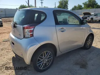 2012 Scion iQ with VIN JTNJJXB05CJ010539, listed as a Copart auction lot 56489245 with 114,623 mi miles and Salvage title. Bid and sale history available at DreamBid. Image 3.