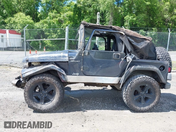 2003 Jeep Wrangler Sport z VIN 1J4FA49S53P317779, wystawiony jako IAAI lot #42388780 z przebiegiem Nie podano mil oraz . Historia ofert i sprzedaży dostępna na DreamBid. Obrazek 13.