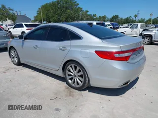 2013 Hyundai Azera z VIN KMHFH4JG6DA321882, wystawiony jako IAAI lot #42351891 z przebiegiem 59 690 mil mil oraz . Historia ofert i sprzedaży dostępna na DreamBid. Obrazek 3.