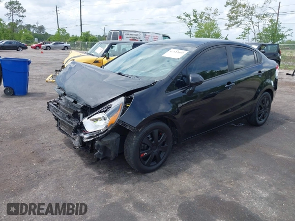 2014 Kia Rio LX with VIN KNADM4A33E6335499, listed as a IAAI auction lot 42123085 with 148,146 mi miles and . Bid and sale history available at DreamBid. Image 2.