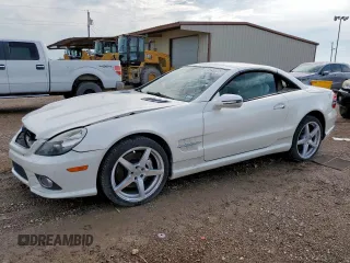 2009 Mercedes-Benz SL 550 with VIN WDBSK71F19F149847, listed as a Copart auction lot 64548875 with 98,236 mi miles and Salvage title. Bid and sale history available at DreamBid. Image 1.