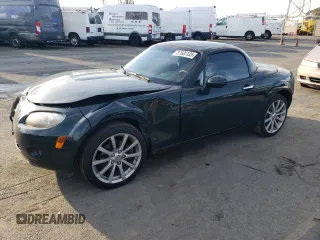 2008 Mazda MX-5 Miata Grand Touring z VIN JM1NC26F280147856, wystawiony jako Copart lot #87600135 z przebiegiem 97 055 mil mil oraz Szkoda całkowita • Salvage title. Historia ofert i sprzedaży dostępna na DreamBid. Obrazek 1.