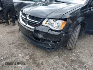 2019 Dodge Grand Caravan SXT with VIN 2C4RDGCG9KR804867, listed as a IAAI auction lot 42032311 with 157,351 mi miles and . Bid and sale history available at DreamBid. Image 6.