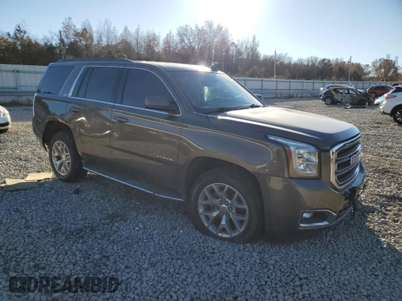 2015 GMC Yukon SLT with VIN 1GKS1BKC8FR664001, listed as a Copart auction lot 84391784 with 0 mi miles and Salvage Title. Bid and sale history available at carsss.com. Image 4.