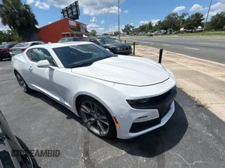 2021 Chevrolet Camaro 1LT with VIN 1G1FB1RS0M0109877, listed as a Copart auction lot 57296035 with 26,486 mi miles and Salvage title. Bid and sale history available at DreamBid. Image 1.
